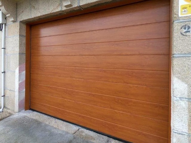 ¡Ahorre en sus facturas instalando puertas de garaje Hörmann!